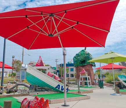 Frankford Recreation Umbrellas providing shade for a recreational mini golf course